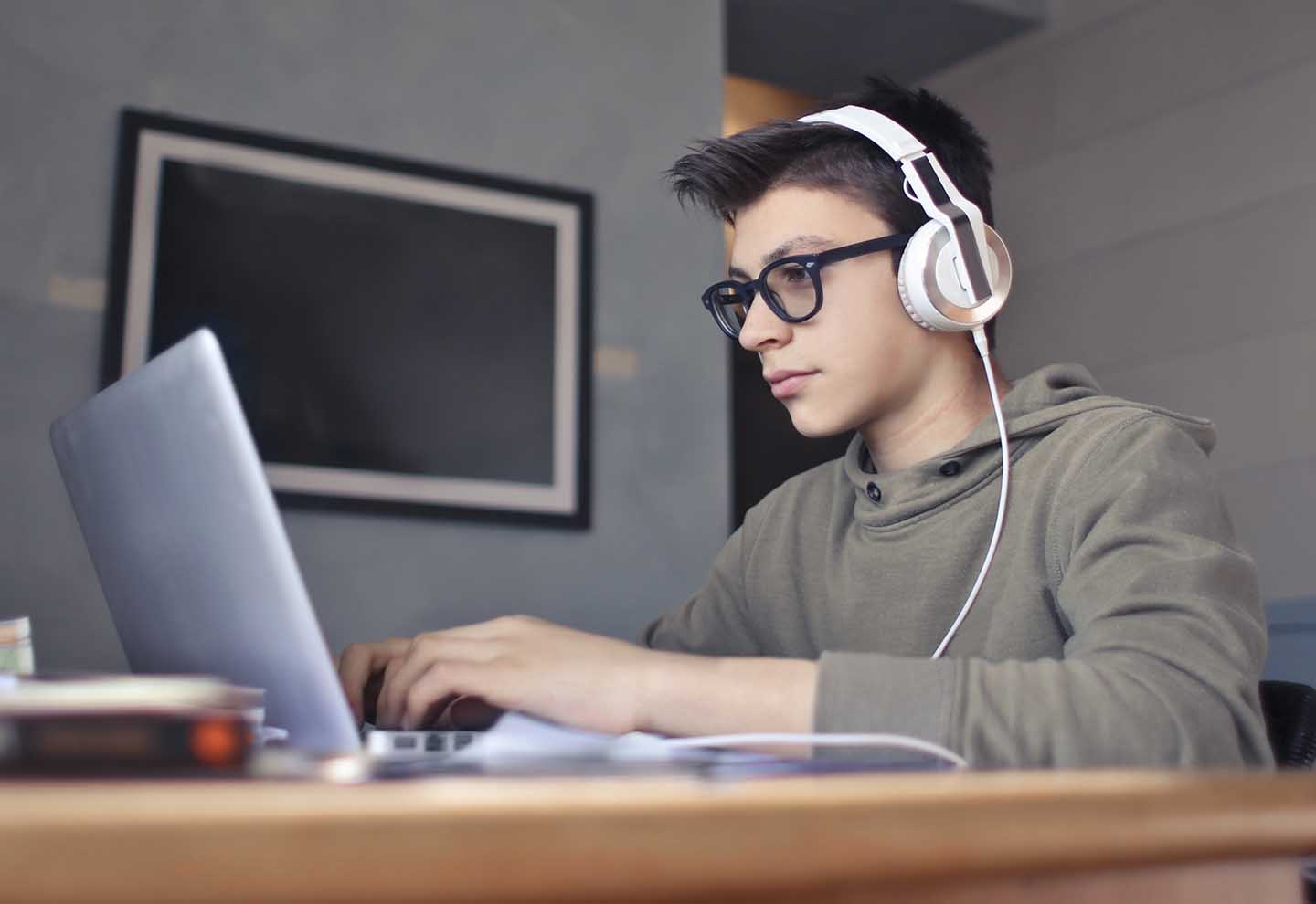 A young boy is learning how to use Unity engine