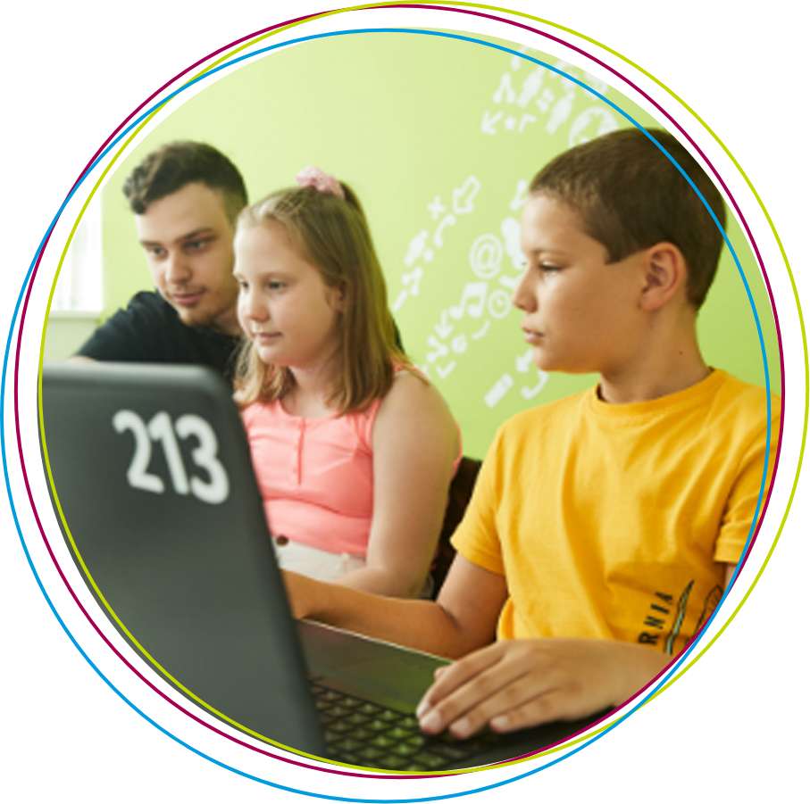 blonde girl with headphones in white t-shirt in front of laptop showing heart sign